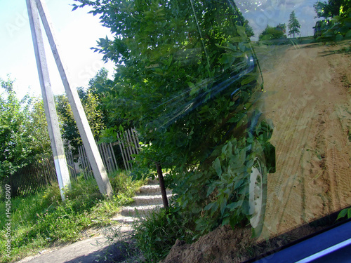 Rural Road: Trees and Reflection in Car Window