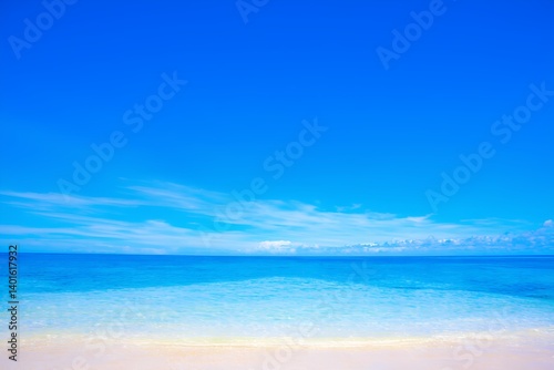 Expansive view of calm ocean waves at midday under a clear blue sky