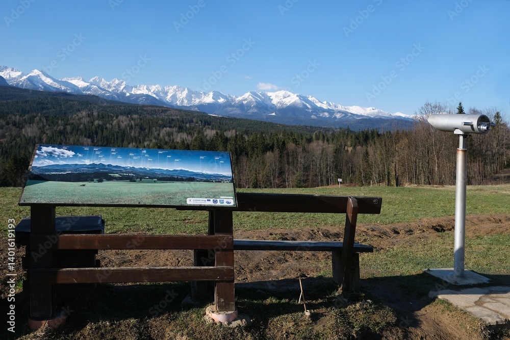 Viewpoint of High Tatras and Bialskie Tatras on Pass over Lapszanka with board information about peaks. Poland