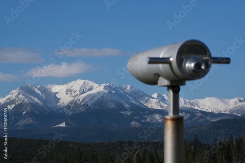 Obraz na płótnie Viewpoint Pass over Lapszanka with snow-capped peaks of High Tatras and Bialskie Tatras mountains and blurred binoculars in foreground, Poland w salonie