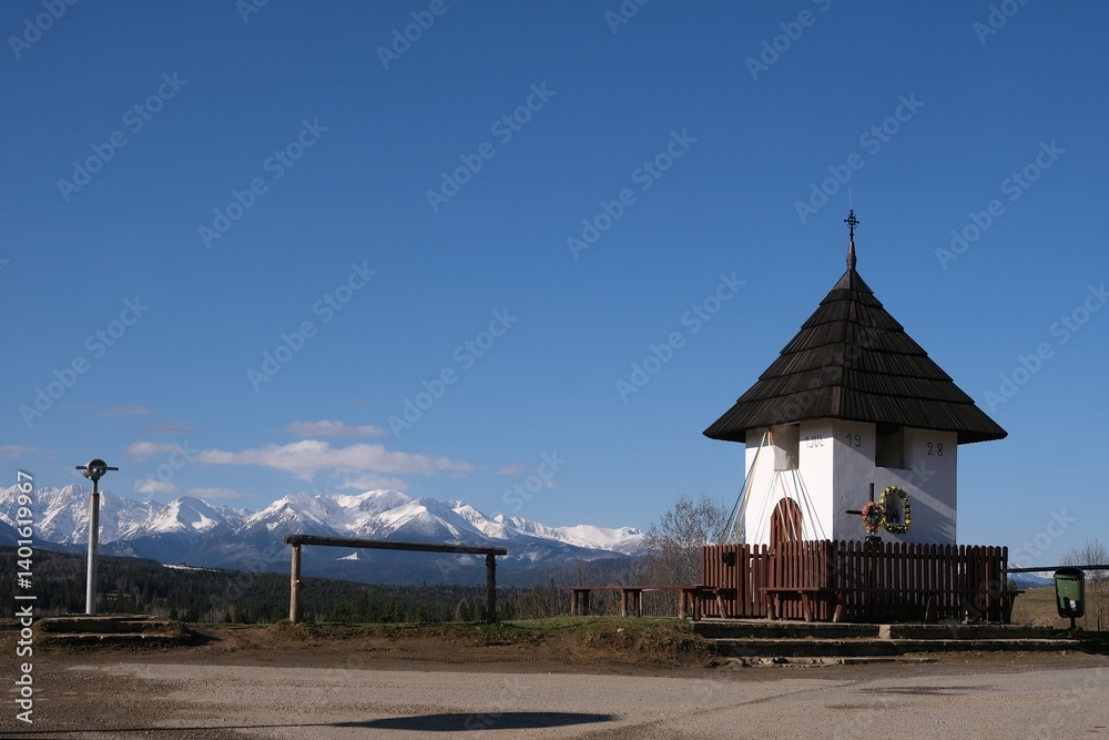 Viewpoint of High Tatras and Bialskie Tatras on Pass over Lapszanka with old white chapel.