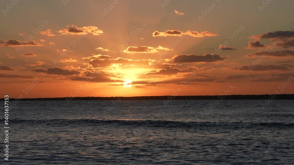 Tropical Sunset Casting Rays Across Open Sea Tropical Sunset Casting Rays Across Open Sea
