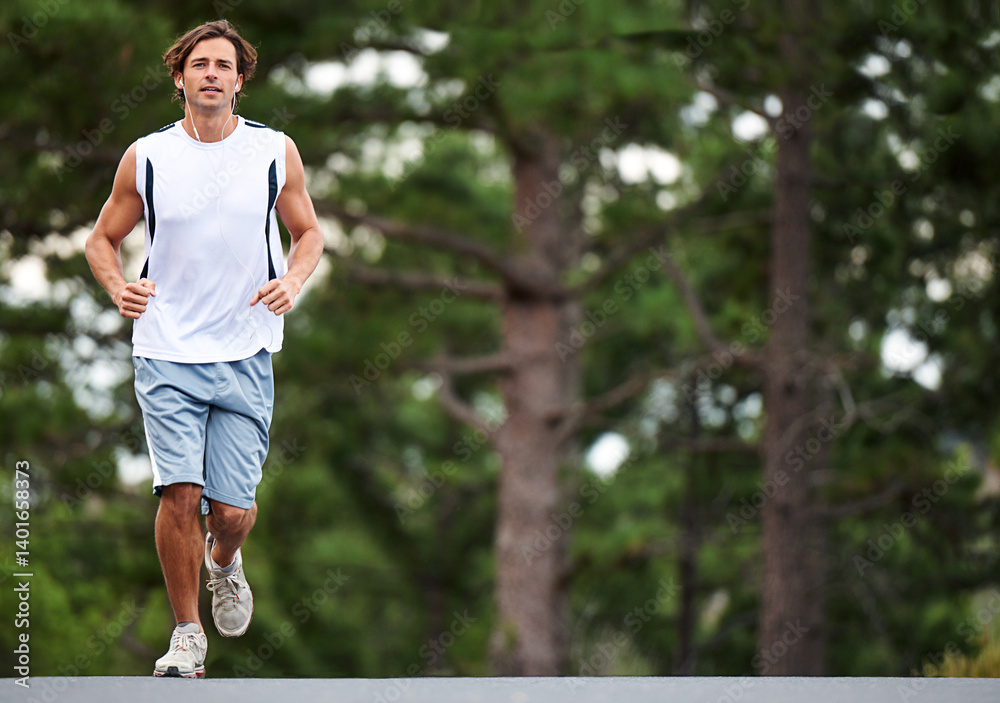 Exercise, man and running on road for fitness, earphones and listening to music, podcast and audio. Male athlete, workout and training for wellness, performance and endurance challenge on street Exercise, man and running on road for fitness, earphones and listening to music, podcast and audio. Male athlete, workout and training for wellness, performance and endurance challenge on street