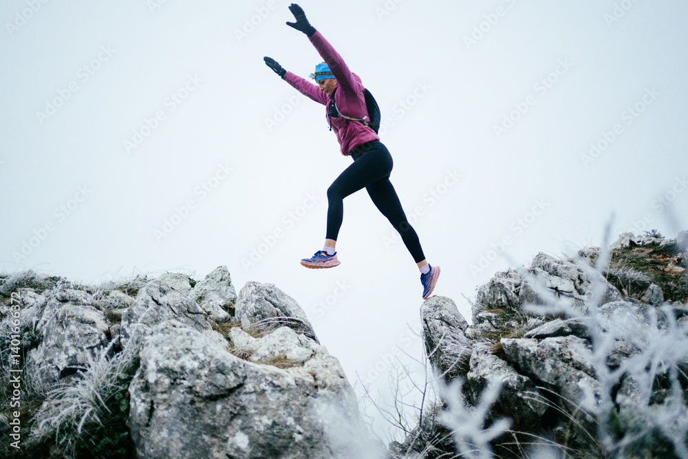 Trail Runner in Misty Mountain Landscape