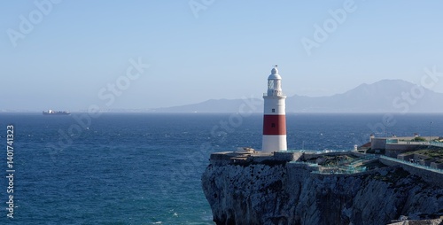 Europa Point Lighthouse guiding ships near Gibraltar, United Kingdom, with Morocco in the background