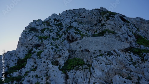 Rock of Gibraltar Ancient stone wall merging with the mountain at dusk