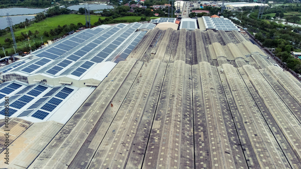 multiple solar panels installed on the rooftop of a building. The solar panels are arranged in neat rows and columns, with clear separations between each panel.