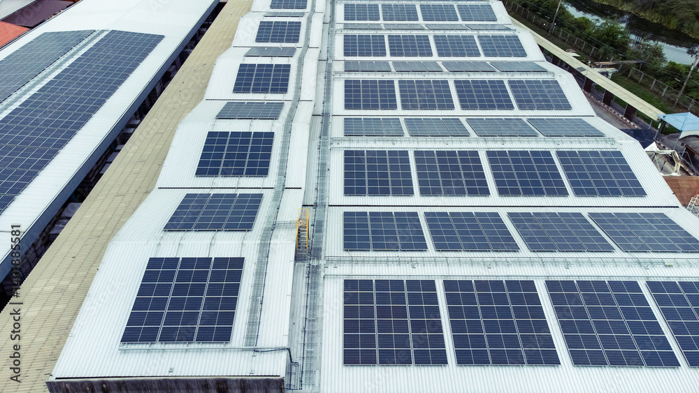 multiple solar panels installed on the rooftop of a building. The solar panels are arranged in neat rows and columns, with clear separations between each panel. multiple solar panels installed on the rooftop of a building. The solar panels are arranged in neat rows and columns, with clear separations between each panel.