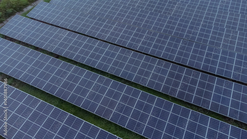 multiple solar panels installed on the rooftop of a building. The solar panels are arranged in neat rows and columns, with clear separations between each panel. multiple solar panels installed on the rooftop of a building. The solar panels are arranged in neat rows and columns, with clear separations between each panel.