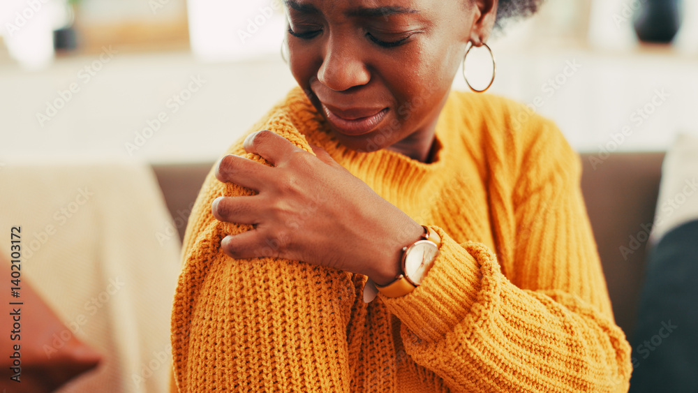 Hands, woman and shoulder pain on couch at house for discomfort, joint inflammation and fibromyalgia. African person, cramps and muscle tension of arthritis, posture injury and strain of arm fracture