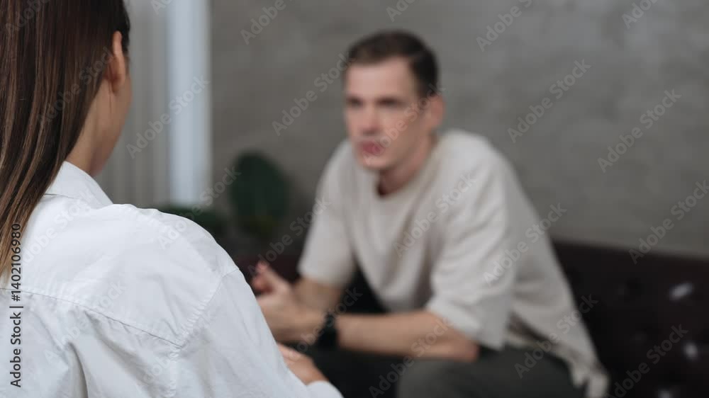 Psychological consultation gaining improvement on mental problem, young patient doing therapy session while psychiatrist making diagnostic on mental illness. Mental treatment session. Adit Psychological consultation gaining improvement on mental problem, young patient doing therapy session while psychiatrist making diagnostic on mental illness. Mental treatment session. Adit