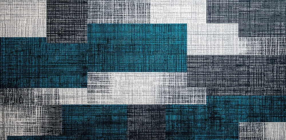 Fototapeta premium A textured fabric background featuring an abstract patchwork design of blue. grey. and black squares. ideal for interior design or textile applications