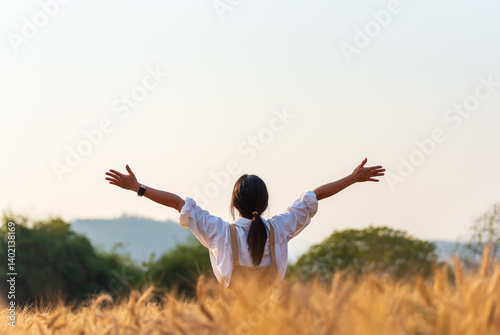 happy young man jumping in the field