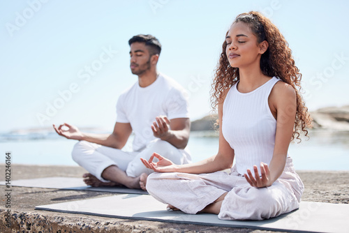 Beach, couple and lotus pose for meditate, mindfulness and holistic wellness outdoor. People, man and woman with zen for bonding in California to relax, peace and mental health in relationship