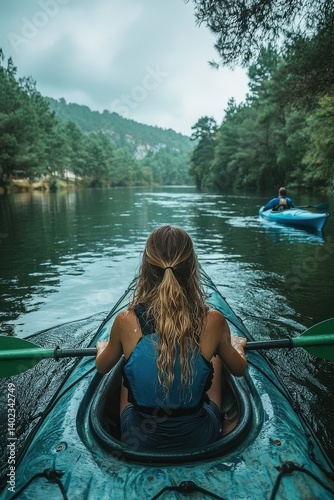 Woman kayaking through a peaceful forest river on a calm summer day