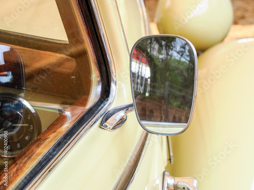 Vintage car detaill. Window and rear mirror.