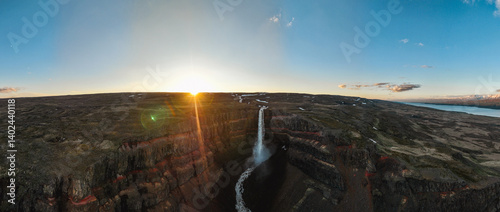 Obraz na płótnie View from above, stunning panoramic view of the Hengifoss Waterfall. Hengifoss, is eye-catching due to the striking red clay and black basalt patterns of the cliff face. East Iceland. w salonie