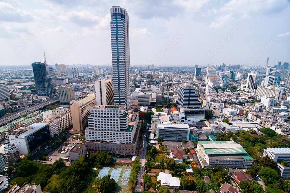 Naklejka premium Aerial View of a Vibrant Urban Cityscape with Modern Skyscrapers and Buildings..