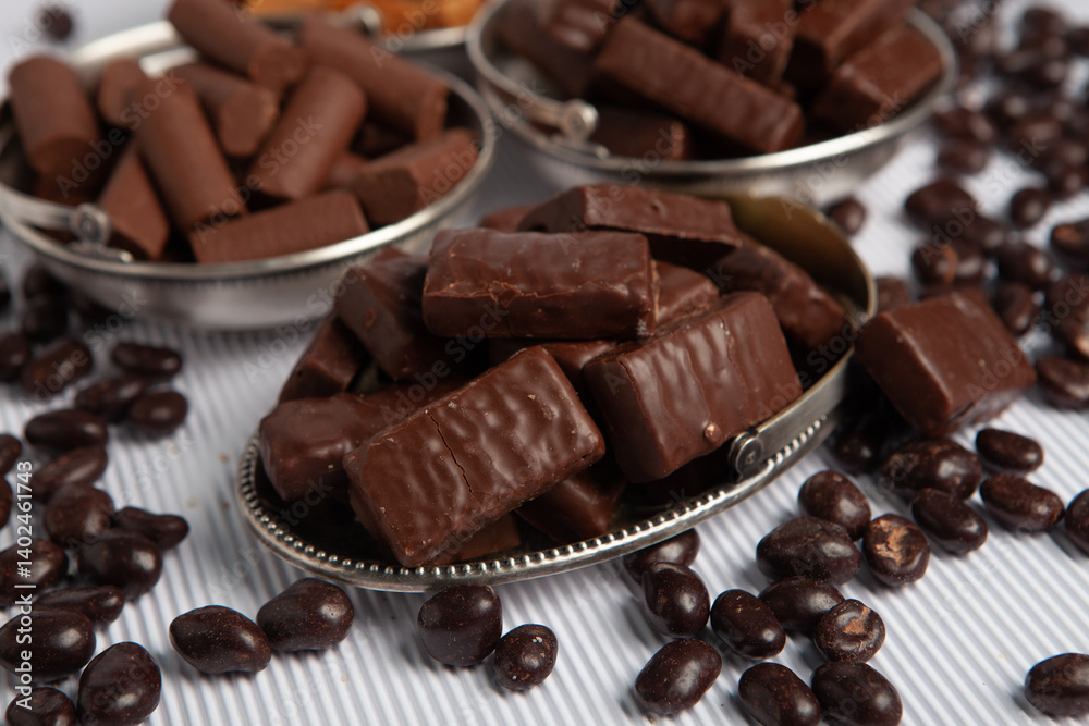 Assortment of sweet confectionery with chocolate candies and pralines. Children's holiday table with chocolate sweets Assortment of sweet confectionery with chocolate candies and pralines. Children's holiday table with chocolate sweets
