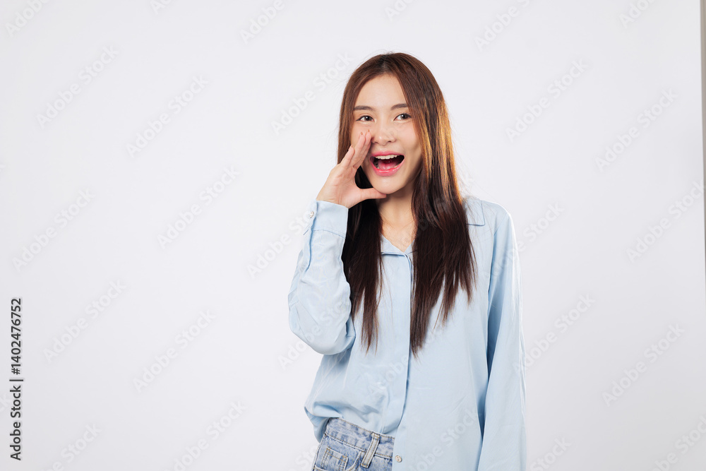 Woman shouting with joy and covering her mouth, another woman makes a news announcement with energy and enthusiasm, captured isolated on a bright white background. Woman shouting with joy and covering her mouth, another woman makes a news announcement with energy and enthusiasm, captured isolated on a bright white background.