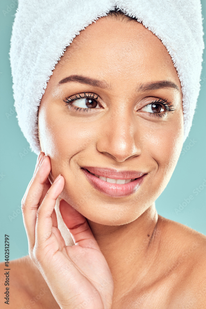 © SneakyPeakPoints/peopleimages.com - Idea, beauty and woman with towel on head in studio for shower, hygiene and smile. Model girl, happy and thinking by blue background for wellness, grooming and glow in with routine and skincare