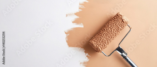 Brown painted wall with paint roller and hand, making of painting a cement wall in brown color