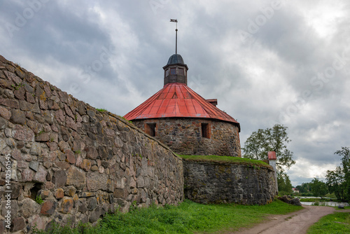 View of the ancient Round Tower of Lars Torstensson (Pugachev Tower) of the Korela Fortress on a cloudy August day. Priozersk. Leningrad Region, Russia