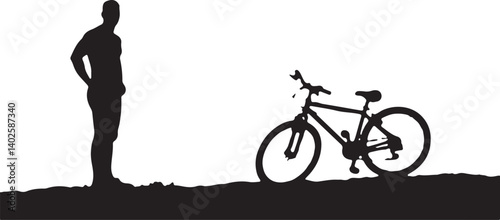 silhouette of a man with a bicycle