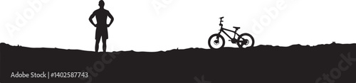 silhouette of a man with a bicycle