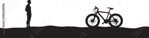 silhouette of a man with a bicycle