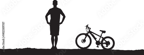 silhouette of a man with a bicycle