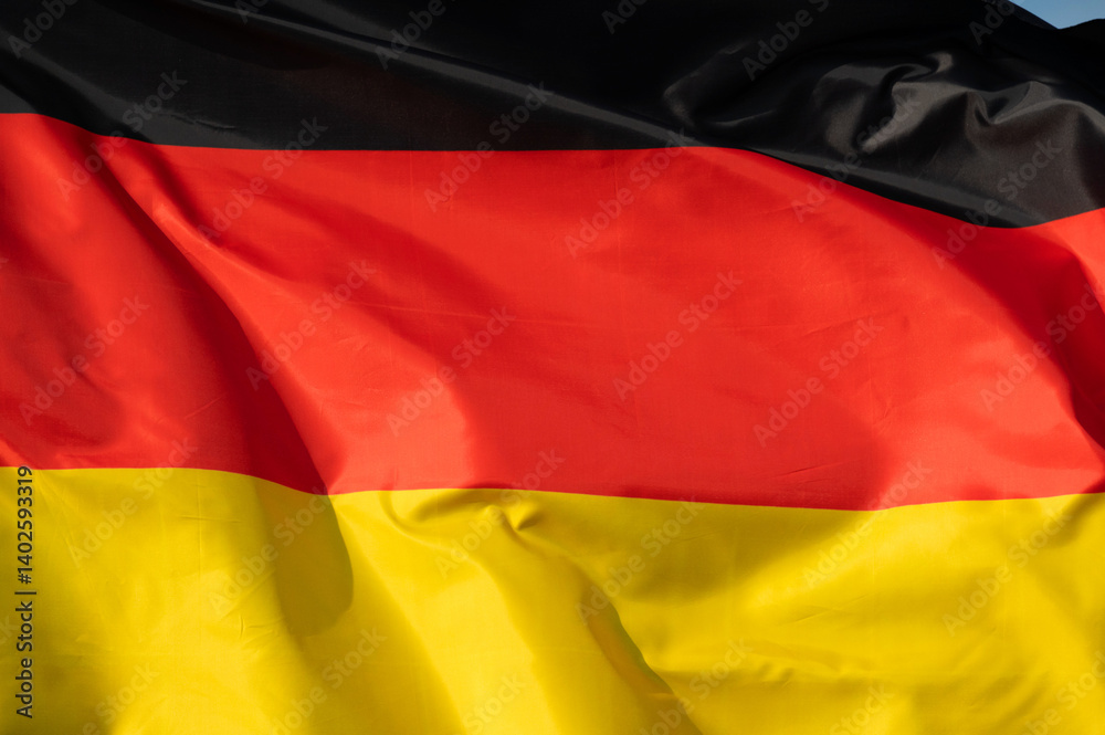 Close-up of a fluttering flag, national flag of Germany Close-up of a fluttering flag, national flag of Germany