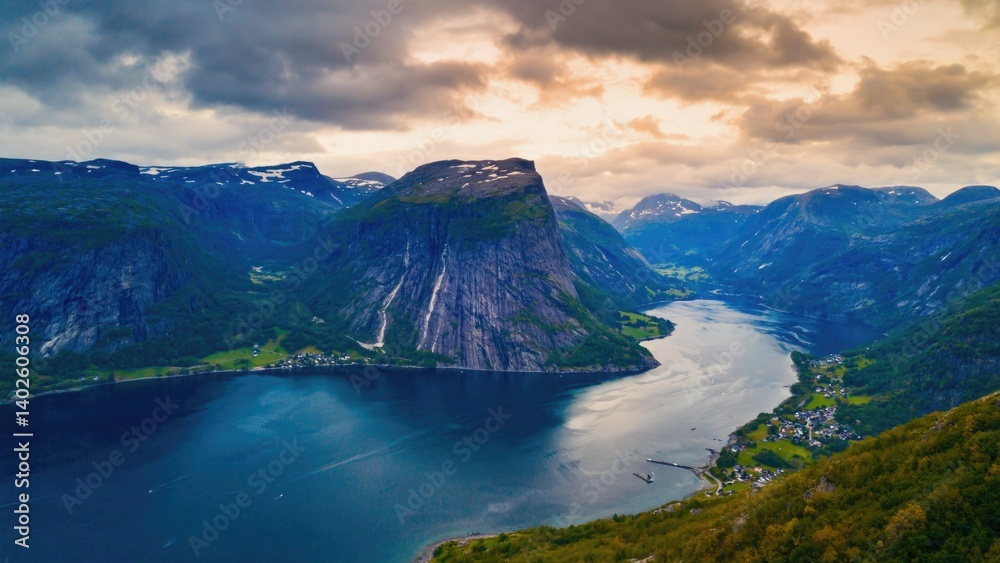 Beautiful view of fjord with mountains and greenery. Great location for outdoor adventure.