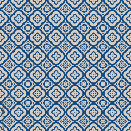 Traditional blue tile seamless pattern with floral shapes. background. Symmetrical rich navy blue backdrop in eastern style for ceramics, textiles, wallpapers, silk. Detailed oriental print.