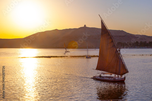 Canvastavla Sailing boat on the Nile river at sunset time, Aswan, Egypt