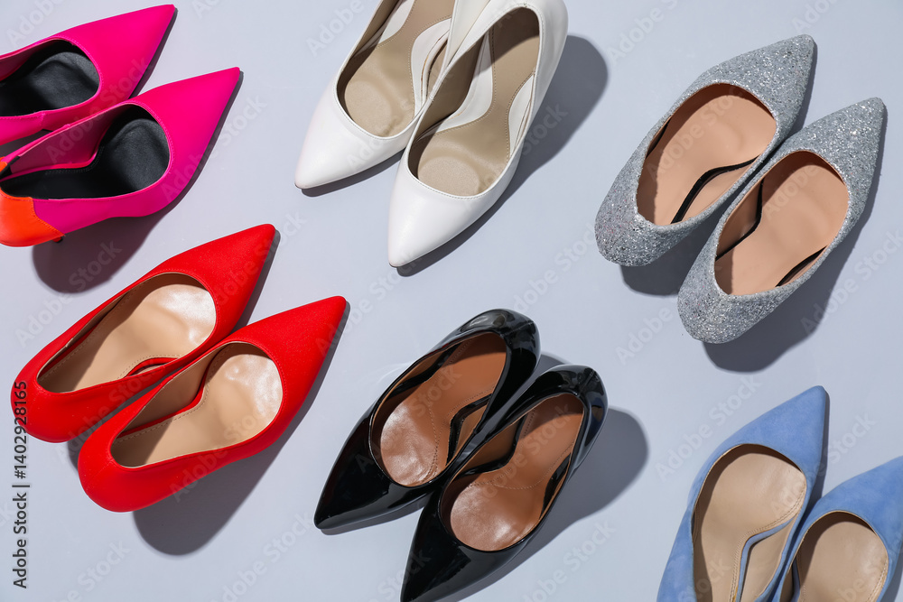 Fototapeta premium High heeled shoes on light background, flat lay