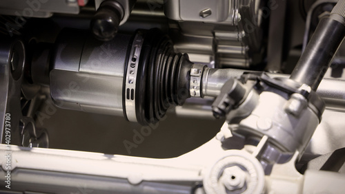 Car suspensions. Close up of a car suspension parts system such as CV joint Rubber boot and Control arms bushing Steering rack axles Shock absorber suspension Brake. Repair and spare parts for cars.