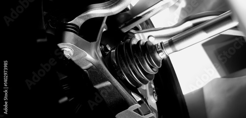 Car suspensions. Close up of a car suspension parts system such as CV joint Rubber boot and Control arms bushing Steering rack axles Shock absorber suspension Brake. Repair and spare parts for cars.