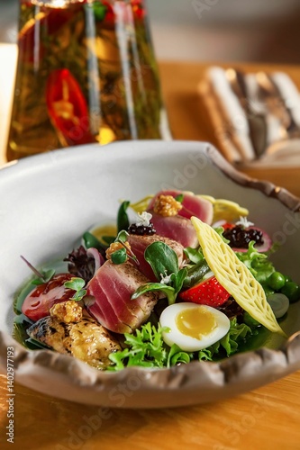 fresh healthy tuna fish egg salad served on the white plate 