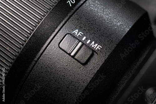 Closeup of the focus window on the camera lens. Close-up of the AF switch on the camera lens. photo