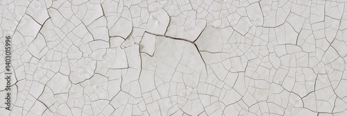 Obraz na płótnie Peeling paint on the wall. Panorama of a concrete wall with old cracked flaking paint. Weathered rough painted surface with patterns of cracks and peeling. Wide panoramic grunge texture for background w salonie