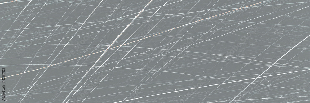 Scratched film texture. Many bright lines in different directions on a dark background. Perfect for vintage design. Wide panoramic background texture.