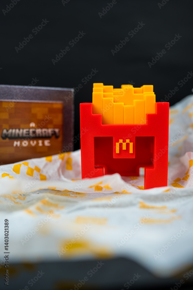 Fototapeta premium Bangkok, Thailand - April 6, 2025 : Fry Helmet Minecraft from McDonald, Toy form Minecraft blind box from McDonald's collaborates Minecraft the movice