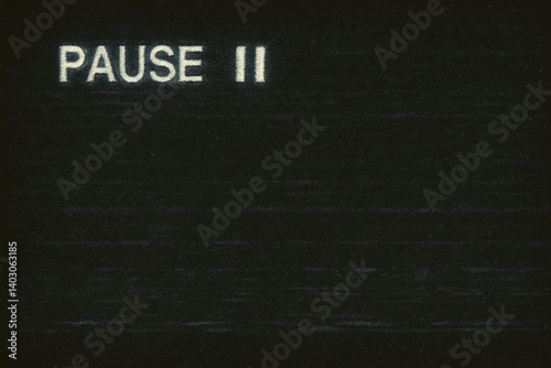 Textured Black Pause Screen With Faded VHS Overlay and Static Noise