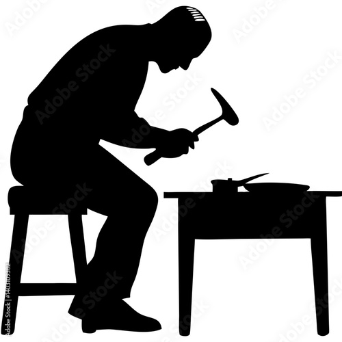 Craftsman Silhouette Concentrating on Metalworking with Hammer and Anvil for Art Projects