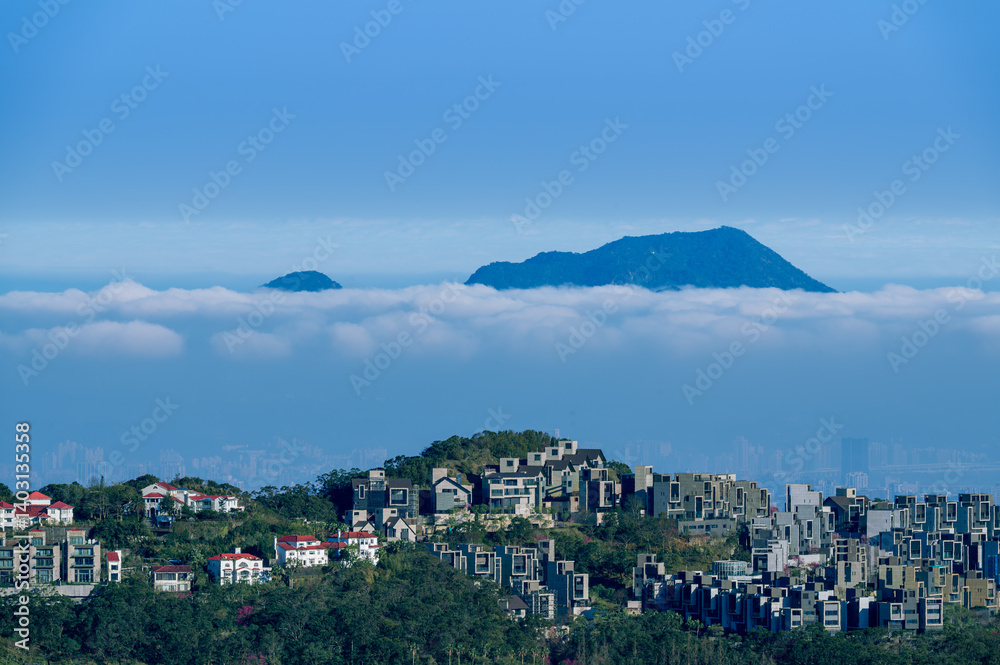 A tranquil spring morning at Lion's Head Mountain in Xindian, Taiwan, with white clouds rolling gently over the mountain peaks, creating a serene and picturesque view. A tranquil spring morning at Lion's Head Mountain in Xindian, Taiwan, with white clouds rolling gently over the mountain peaks, creating a serene and picturesque view.