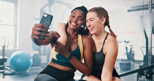 Fototapeta Naklejka Na Ścianę i Meble -  Happy, friends and women in gym selfie with partnership, bonding and team workout together. Photography, athlete and personal trainer at sports club for exercise, fitness influencer and social media