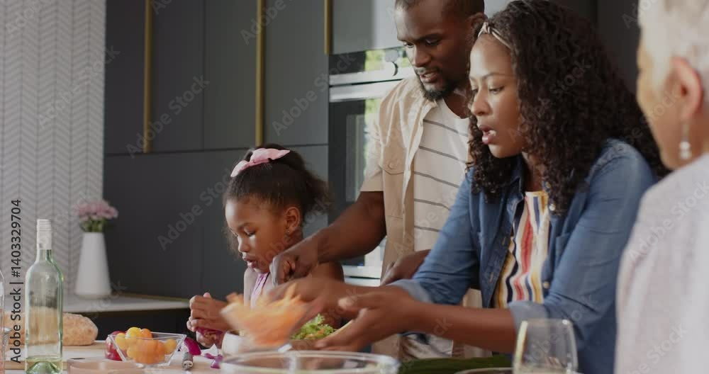 In kitchen, multigenerational diverse family preparing healthy meal, smiling warmly, at home