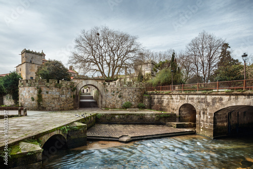 Historic convent and stone bridge over river, Vilagarcia de Arousa, Galicia, Spain