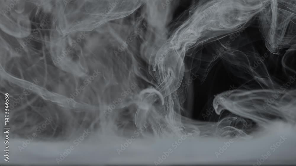 Wisps of White Smoke Creating Abstract Visual Patterns